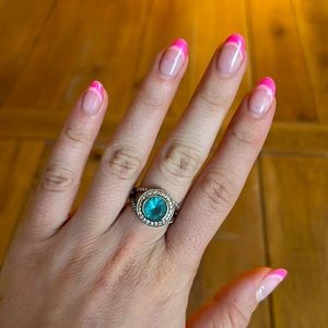Silver ring with blue gem